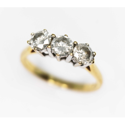 110 - A three stone diamond ring, the round brilliant diamonds weighing approx. 0.90ct in total, hallmarke... 