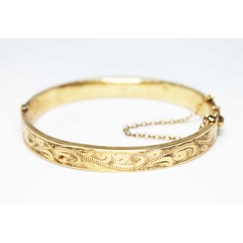 112 - A hallmarked 9ct gold bangle, diameter approx. 5.5cm, wt. 13.1g.