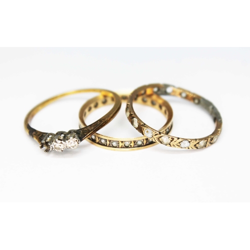 116 - A group of three rings, one set withe diamonds indistinctly marked 'PLAT 18ct', an eternity marked '... 