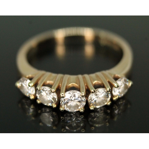 122 - A five stone diamond ring, the round brilliant cut diamonds weighing approx. 0.16, 0.20, 0.24, 0.17 ... 