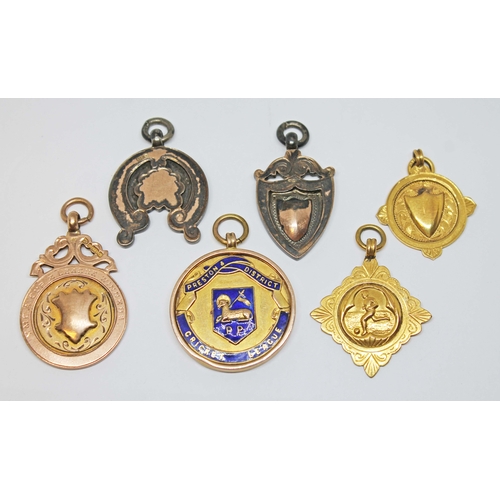 124 - A football and cricket medal collection comprising four hallmarked 9ct gold and two hallmarked silve... 