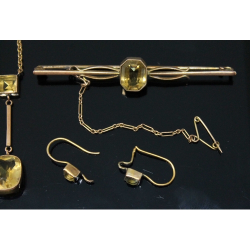 126 - A suite of citrine set jewellery, early 20th century, comprising pendant necklace, bar brooch and pa... 