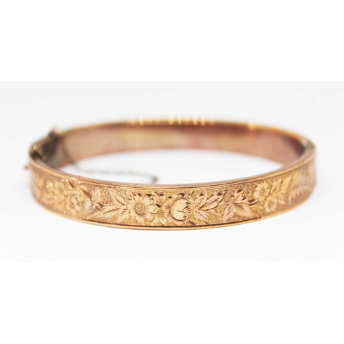 129 - An Edwardian engraved 9ct gold bangle, sponsor's mark 'A.I', Birmingham 1903, diam. approx. 55mm, wt... 