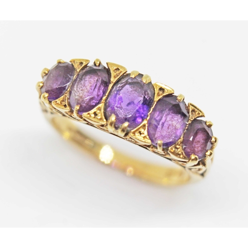 132 - A five stone amethyst ring, scroll setting, hallmarked 18ct gold, sponsor's mark 'AJW', London 1967,... 