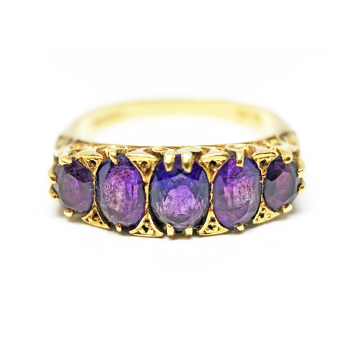 132 - A five stone amethyst ring, scroll setting, hallmarked 18ct gold, sponsor's mark 'AJW', London 1967,... 