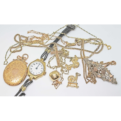 141 - A mixed lot comprising a locket marked '9ct', a hallmarked 9ct gold watch, an apple pendant marked '... 