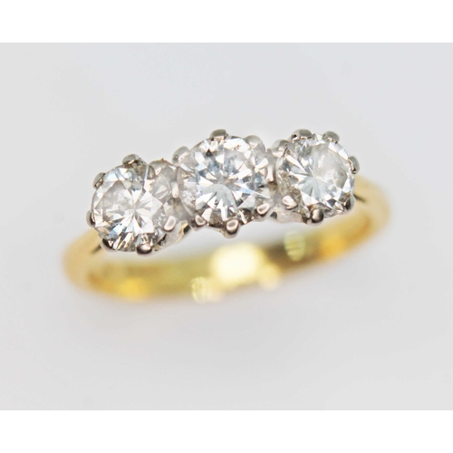 142 - A three stone diamond ring, the round brilliant cut diamonds weighing approx. 0.38, 0.44 & 0.41 cara... 