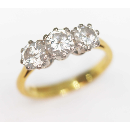 142 - A three stone diamond ring, the round brilliant cut diamonds weighing approx. 0.38, 0.44 & 0.41 cara... 