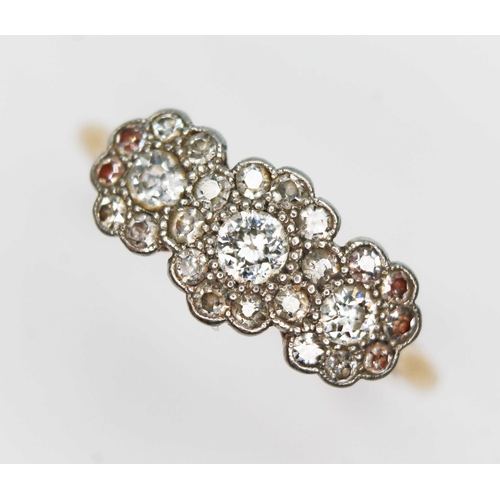 143 - An early 20th century diamond cluster ring, formed from three transitional round cut diamonds twenty... 