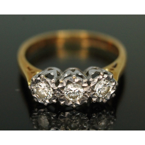 145 - A hallmarked 18ct gold three stone diamond ring, total approx. diamond wt. 0.31 carats, gross wt. 2.... 