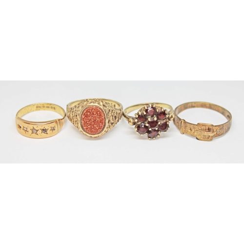 147 - A group of four hallmarked 9ct gold rings comprising one set with goldstone, a garnet cluster, a buc... 