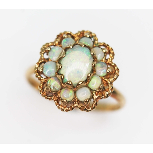 158 - An opal cluster ring, the head measuring approx. 14.57mm x 14mm, 9ct import marks, gross wt. 2.4g, s... 