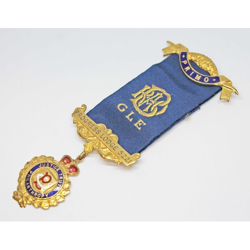 161 - A hallmarked 9ct gold ROAB medallion, suspended on blue ribbon with two gilt metal bars, gold wt. 5g... 