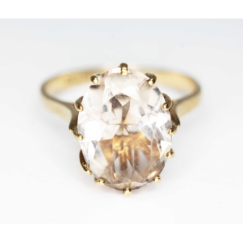 165 - A hallmarked 9ct gold ring set with an oval mixed cut quartz, gross wt. 3.2g, size Q.