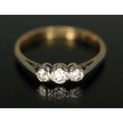 168 - A three stone diamond ring, marked 18CT PLAT', gross wt. 2.1g, size L.