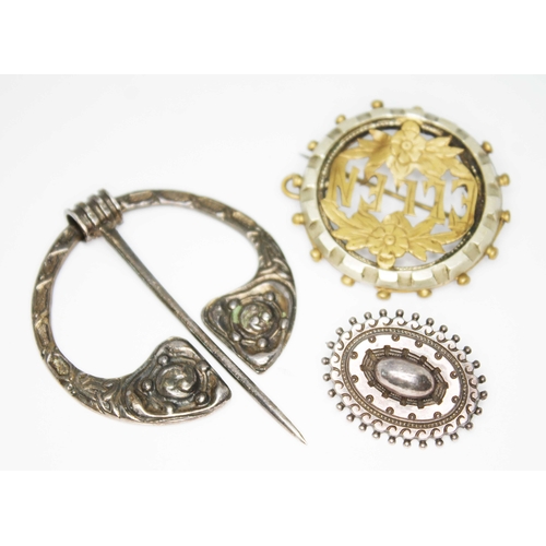 171 - A Scottish silver kilt pin by Robert Allison, Glasgow 1952, a hallmarked silver brooch and another.