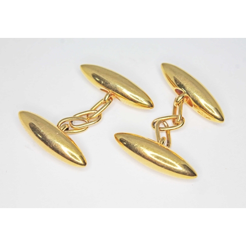 173 - A pair of early 20th century torpedo shaped cufflinks marked '15', wt. 7.3g.