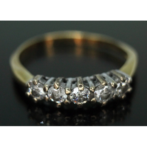 212 - A five stone diamond ring, 18ct gold import marks, gross wt. 2g, size K (band bent).