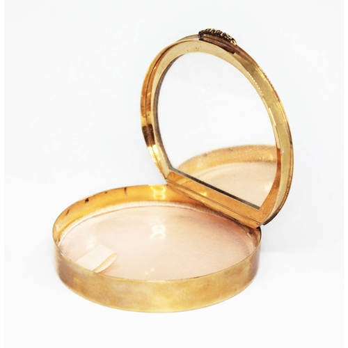 208 - A vintage 9ct gold compact, of round form, the top and bottom engraved with 'waves', cast thumb piec... 