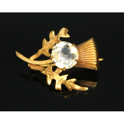 209 - A 9ct gold thistle brooch set with a citrine, Birmingham 1965, length 30mm, gross wt. 3g.