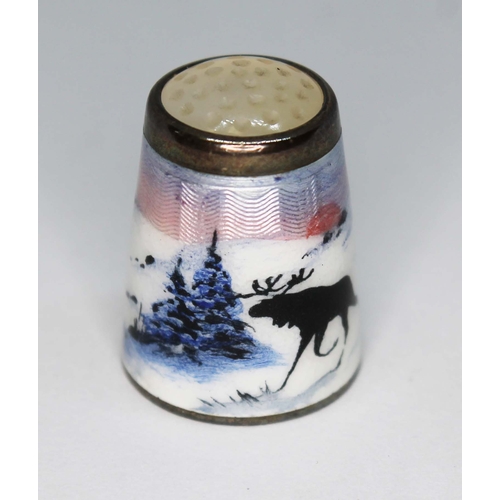 224 - A Norwegian sterling silver and enamel thimble depicting reindeer within a winter landscape, Aksel H... 