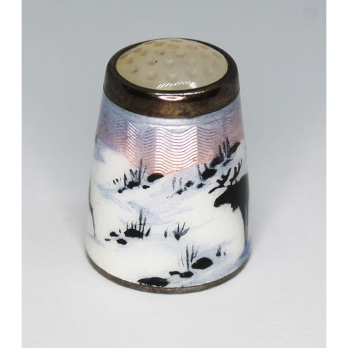 224 - A Norwegian sterling silver and enamel thimble depicting reindeer within a winter landscape, Aksel H... 