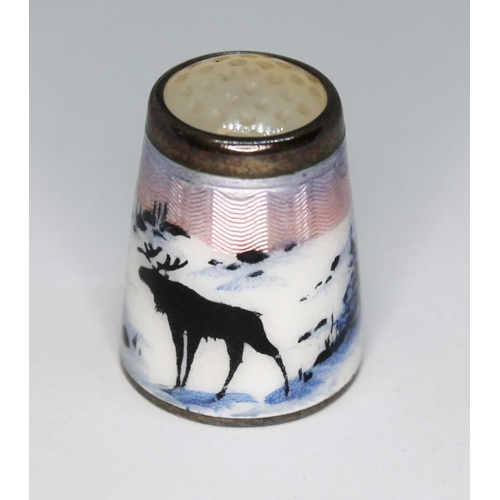 224 - A Norwegian sterling silver and enamel thimble depicting reindeer within a winter landscape, Aksel H... 