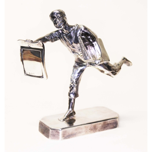 229 - An Elkington & Co silver and silver plated figure depicting a news paper boy, height 15cm.