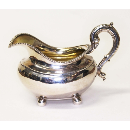 233 - A Georgian hallmarked silver cream jug, marks rubbed, length 16cm, wt. 6.7ozt.