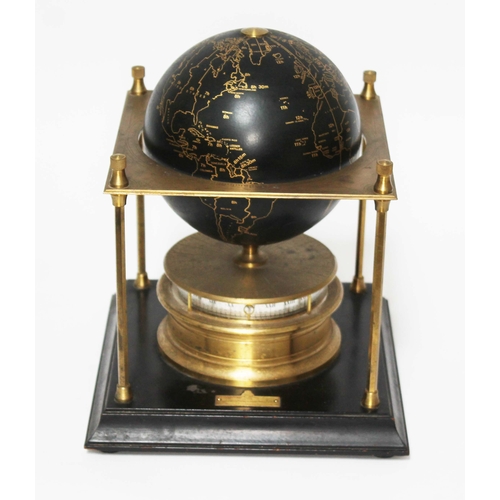 268 - A Royal Geographical Society World Clock, height 28cm.