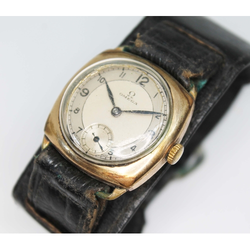 85 - A 1934 Omega gold plated trench type watch, signed two colour dial with Arabic numerals and seconds ... 