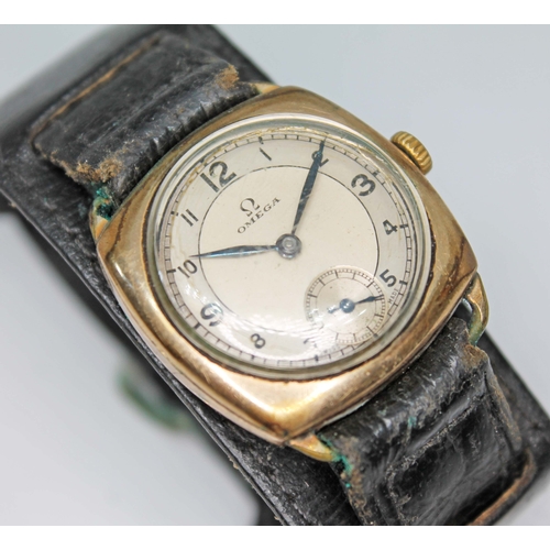 85 - A 1934 Omega gold plated trench type watch, signed two colour dial with Arabic numerals and seconds ... 