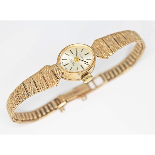 89 - A ladies hallmarked 9ct gold Excalibur wristwatch with 9ct gold strap, gross wt. 16.2g.