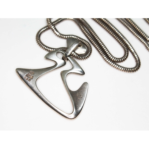 79A - A Danish Modernist silver pendant no. 125 designed by Henning Koppel for George Jensen circa 1955, L... 