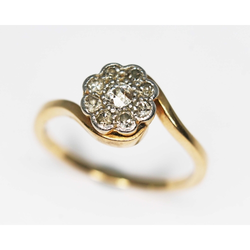 79C - An early 20th century diamond cluster ring, the head measuring approx. 8.04mm in diameter, yellow me... 