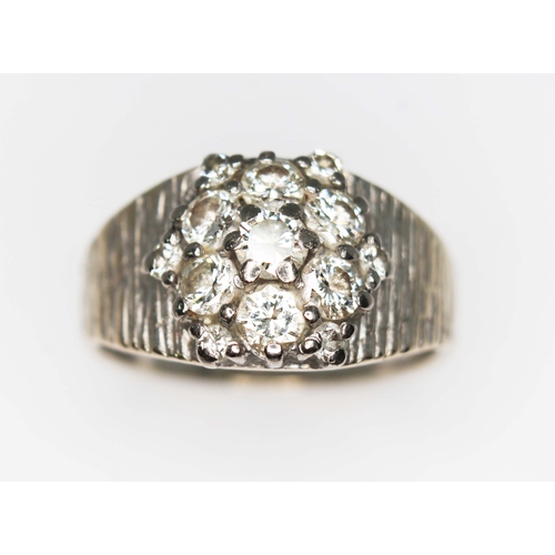 79D - A diamond cluster ring, total approx. diamond wt. 0.82cts (estimated while set), white metal band ma... 