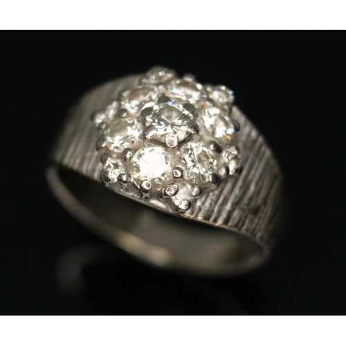 79D - A diamond cluster ring, total approx. diamond wt. 0.82cts (estimated while set), white metal band ma... 