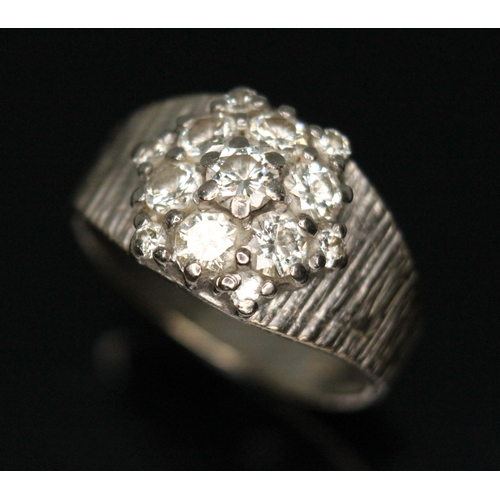 79D - A diamond cluster ring, total approx. diamond wt. 0.82cts (estimated while set), white metal band ma... 