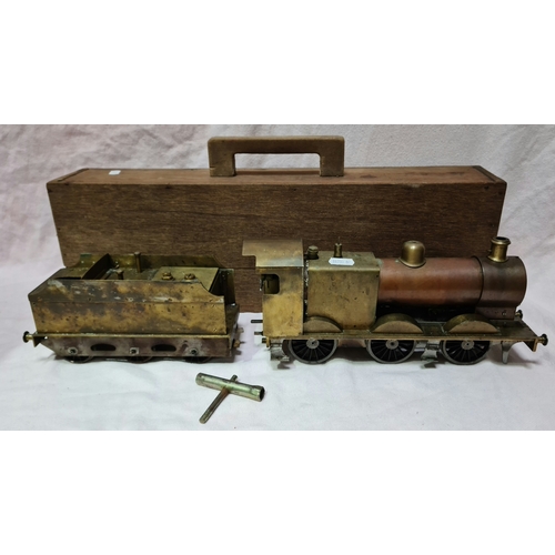 33 - A scratch built 0 gauge live steam engine with tender and wooden case.