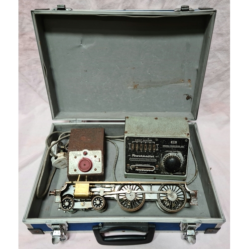 42 - A case containing a part built engine and two controllers.