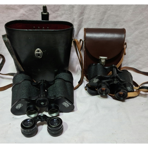 104 - 2 cased pairs of Carl Zeiss Jena Jenoptem binoculars, 8x30 w & 10x50 W.