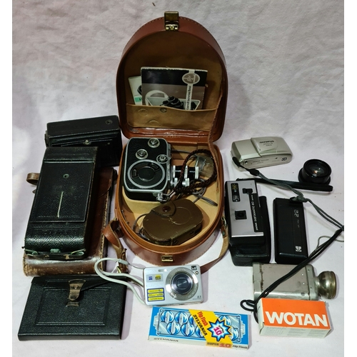 113 - A box of cameras & accessories to include a Paillard - Bolex cine cam with western master III light ... 