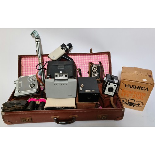 114 - A vintage suitcase with various cameras, binoculars and accessories to include a Chinon facel II, Po... 