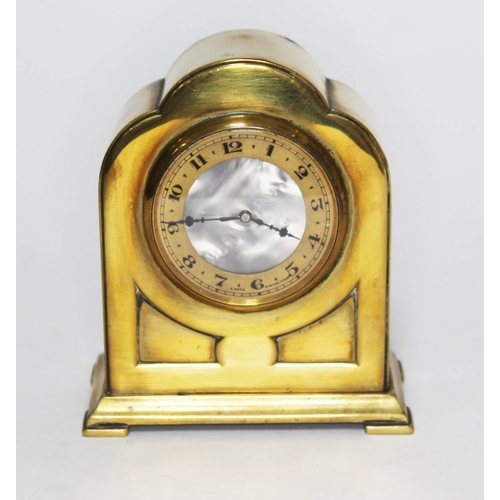 117 - A brass eight day clock with mother of pearl dial, height 10.5cm.