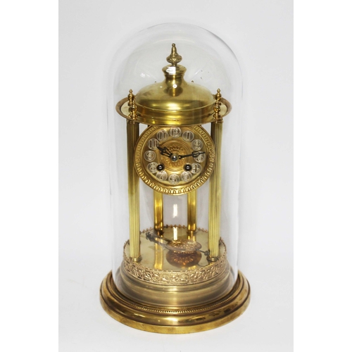 123 - A French six pillar brass bandstand clock with glass dome, height 41cm.