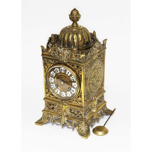 126 - A French pierced brass 30 day clock, striking on a bell, height 31cm.