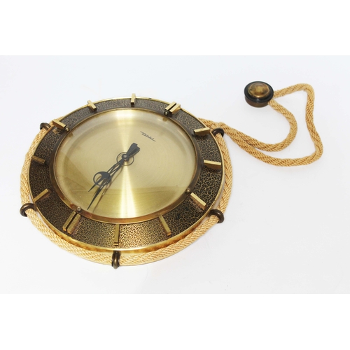131 - A mid 20th century Diehl wall clock modelled as a ship's wheel with rope border and hanging from rop... 