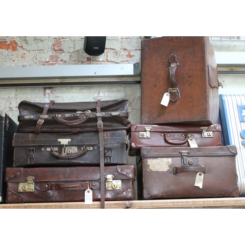 193 - A group of seven leather and leather effect vintage cases.