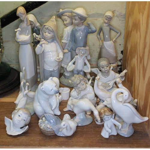 351 - A collection of thirteen Lladro figures and a few others similar.