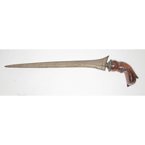 100 - A Burmese Kris, double edged steel blade, wooden handle, total length 36cm.